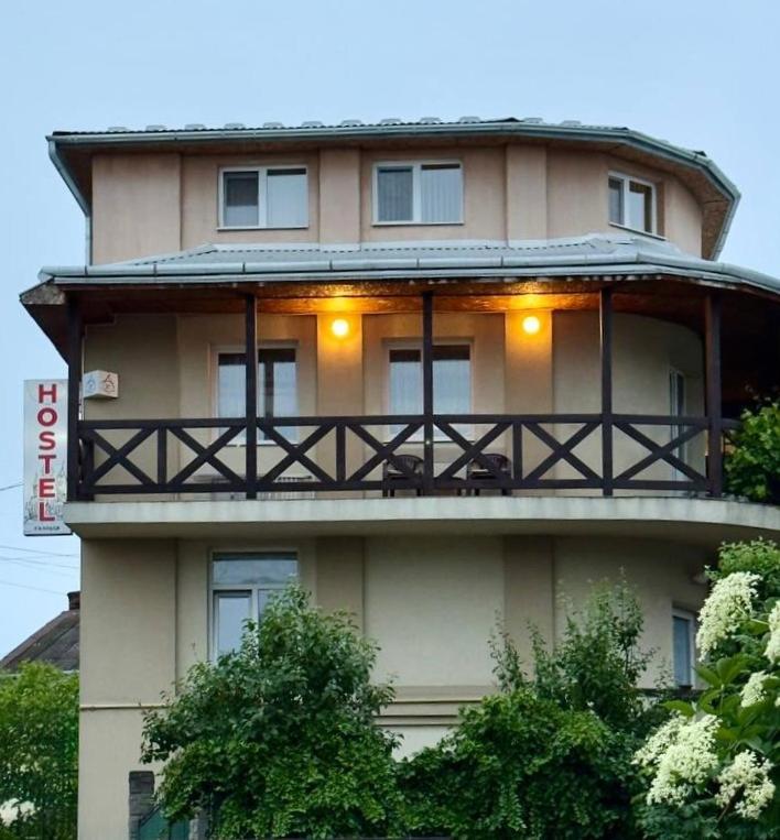 a large building with a balcony on top of it at хостел Галіція in Kolomiya