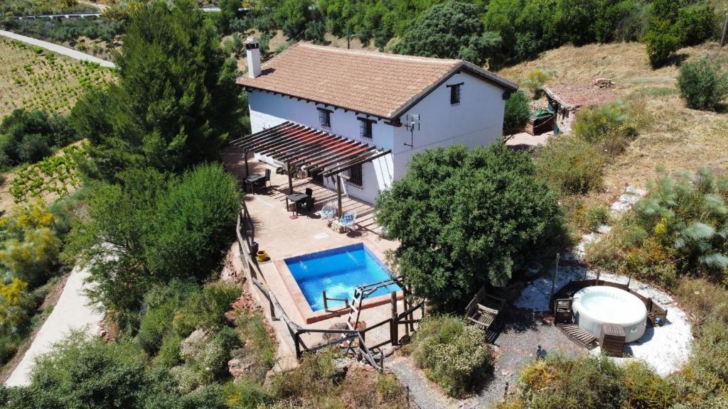 an overhead view of a house with a swimming pool at Casa KiSi Hotel, Rural Boutique Bed & Breakfast in Colmenar