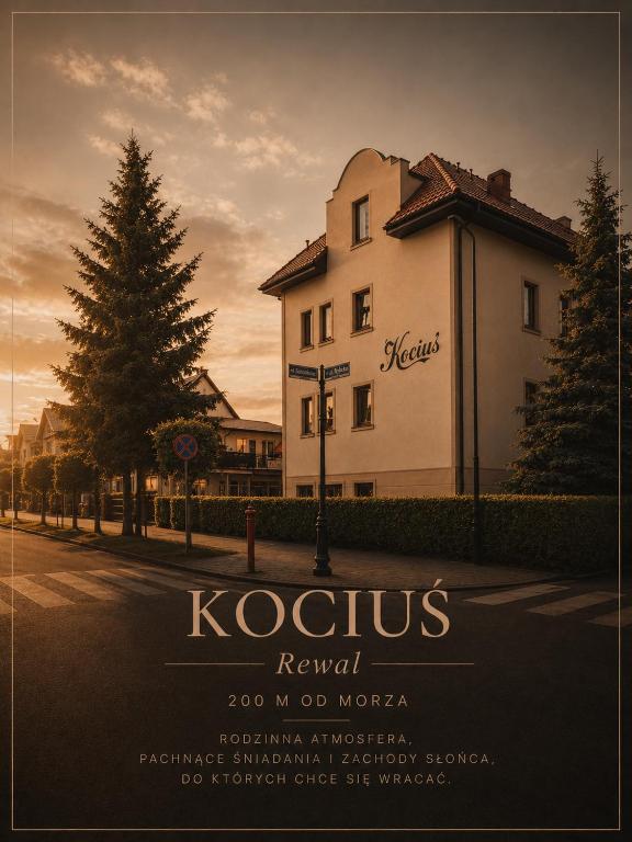 a building on a street with a tree in front of it at Pensjonat Kocius in Rewal