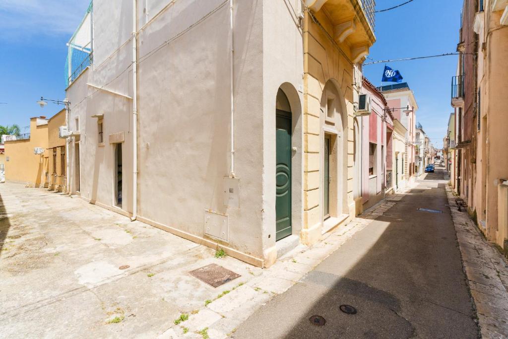 an empty street in an old town at Luxury Rooms in Alezio