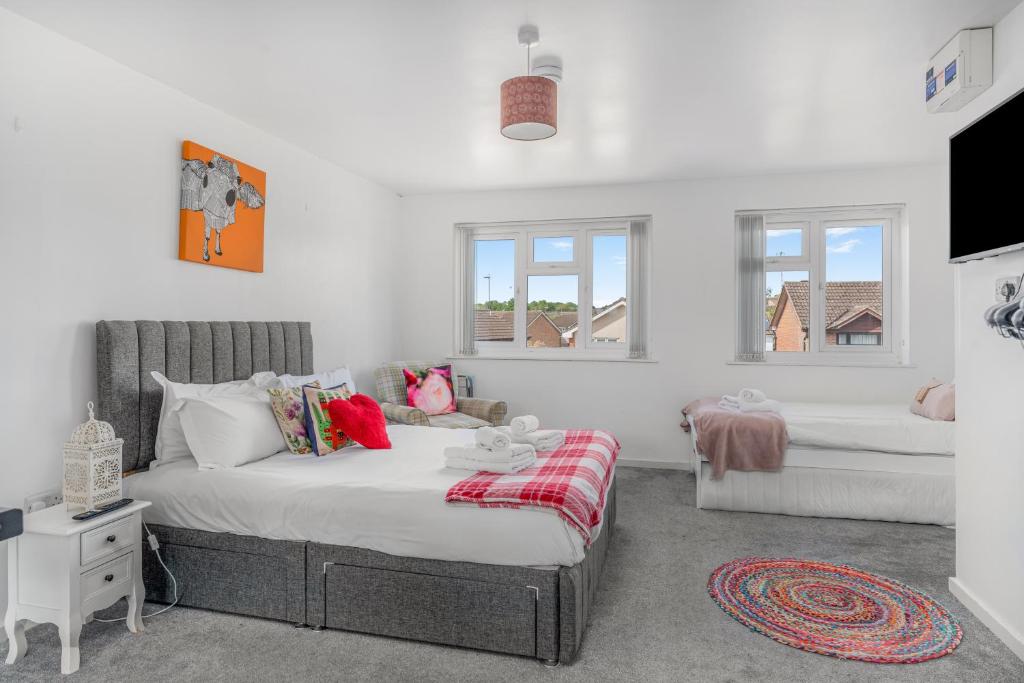 a bedroom with a bed and a bath tub at Badger Haven, Apartment 4 in Brackley