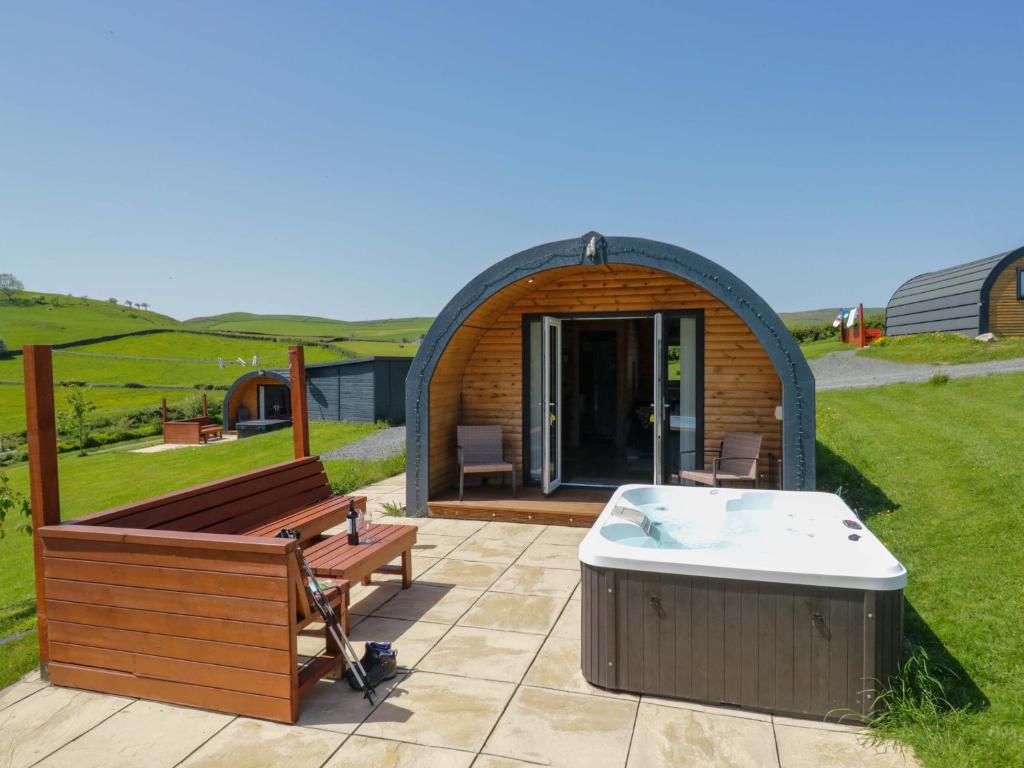 a gazebo with a hot tub and a hot tub at Cherry in Ulverston