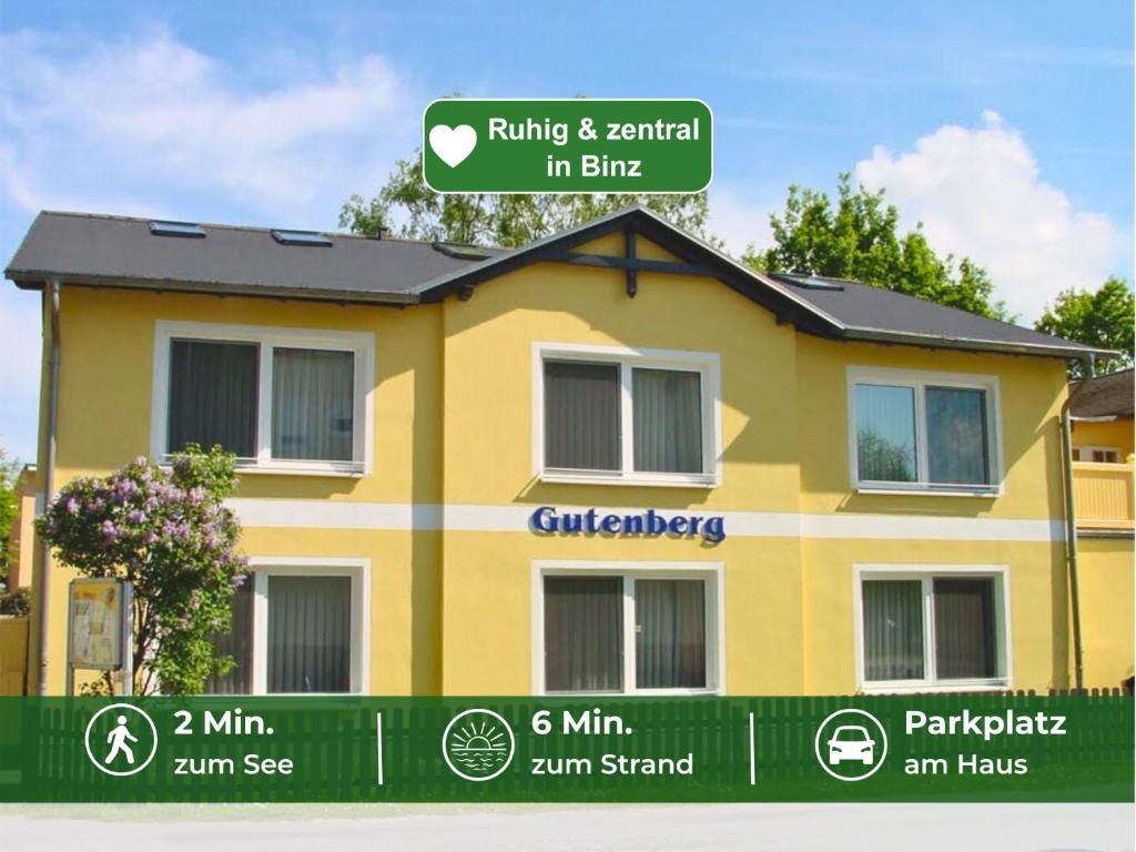 a yellow house with a sign that reads rule rental in bite at Appartementhaus Gutenberg - Ruhig & zentral in Binz - Parkplatz kostenlos - 6 Min zum Ostseestrand in Binz