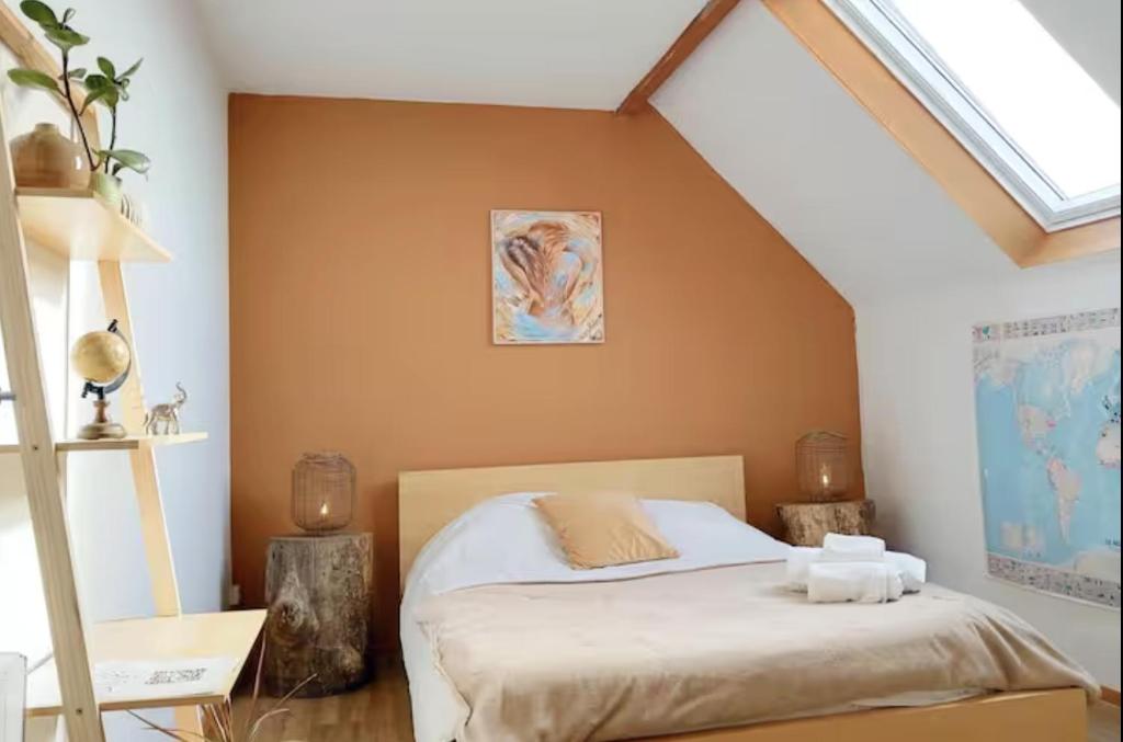 a bedroom with a bed in a attic at Domaine d'Equital'Or in Cressanges