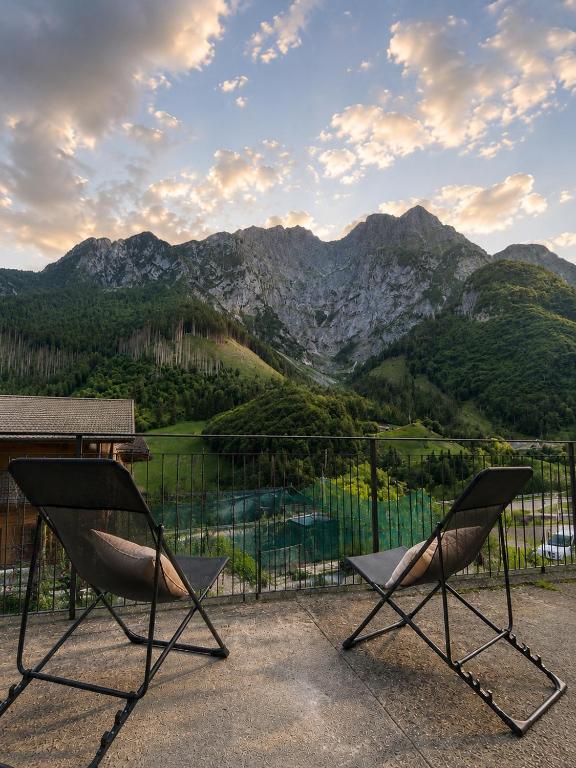 two chairs on a balcony with a view of mountains at Mountain Getaway Panoramic View - Pets Welcome in Gromo