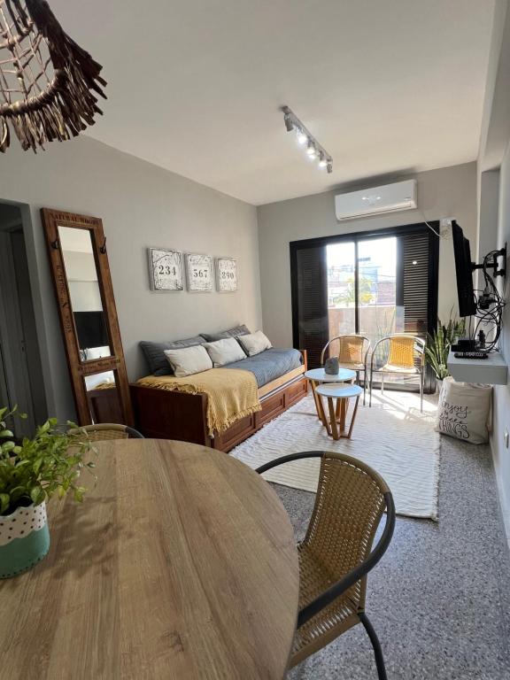 a living room with a table and a couch at Departamento de Josefina in Santiago del Estero