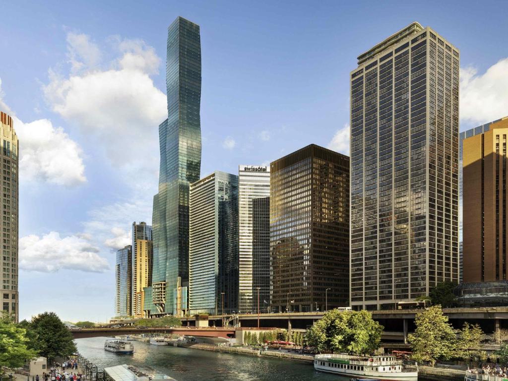 a city skyline with a river and tall buildings at Swissotel Chicago in Chicago
