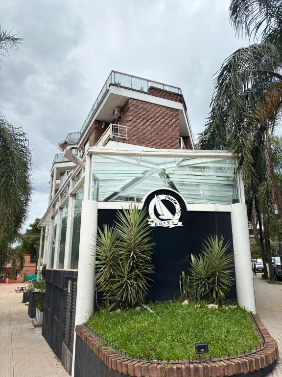 a building with a sign on the side of it at Apart Hotel Punta Vip in Colón