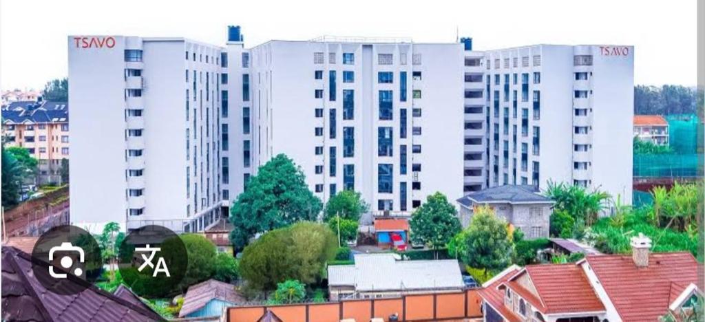 a view of a city with tall white buildings at Urban Haven Homes in Kiambu