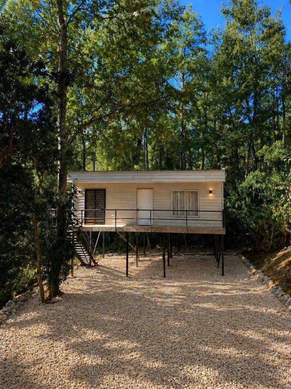 a mobile home is parked in the woods at Cabaña Payer in Villarrica