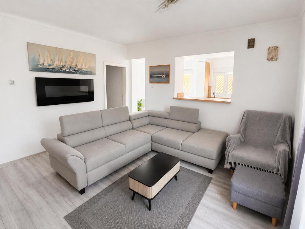 a living room with a couch and two chairs at Braavos apartments Šibenik Deluxe near Marina in Šibenik