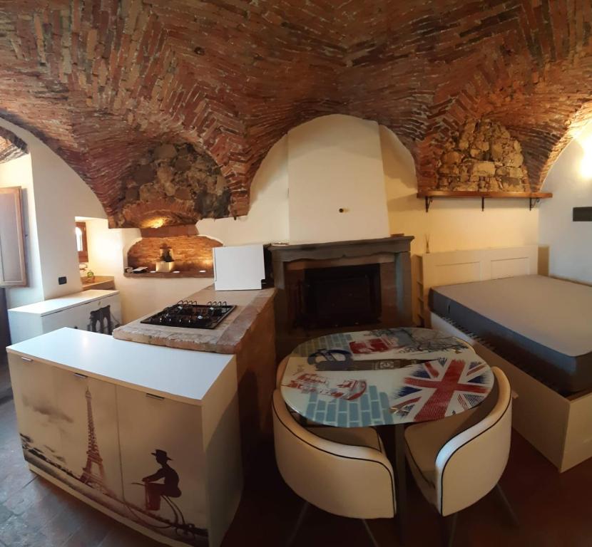 a living room with a bed and a stove at Il Nido di Ory in Clusane sul Lago