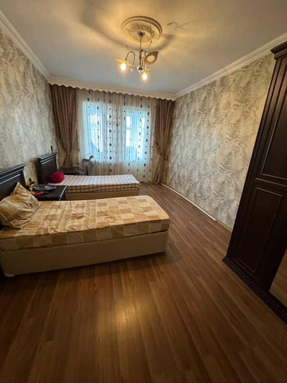 a bedroom with two beds in a room at Evv in Naxçıvan