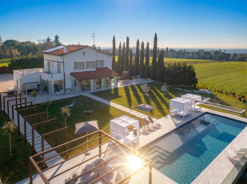 an aerial view of a villa with a swimming pool at VILLA OXA 12&2, Emma Villas in Imola