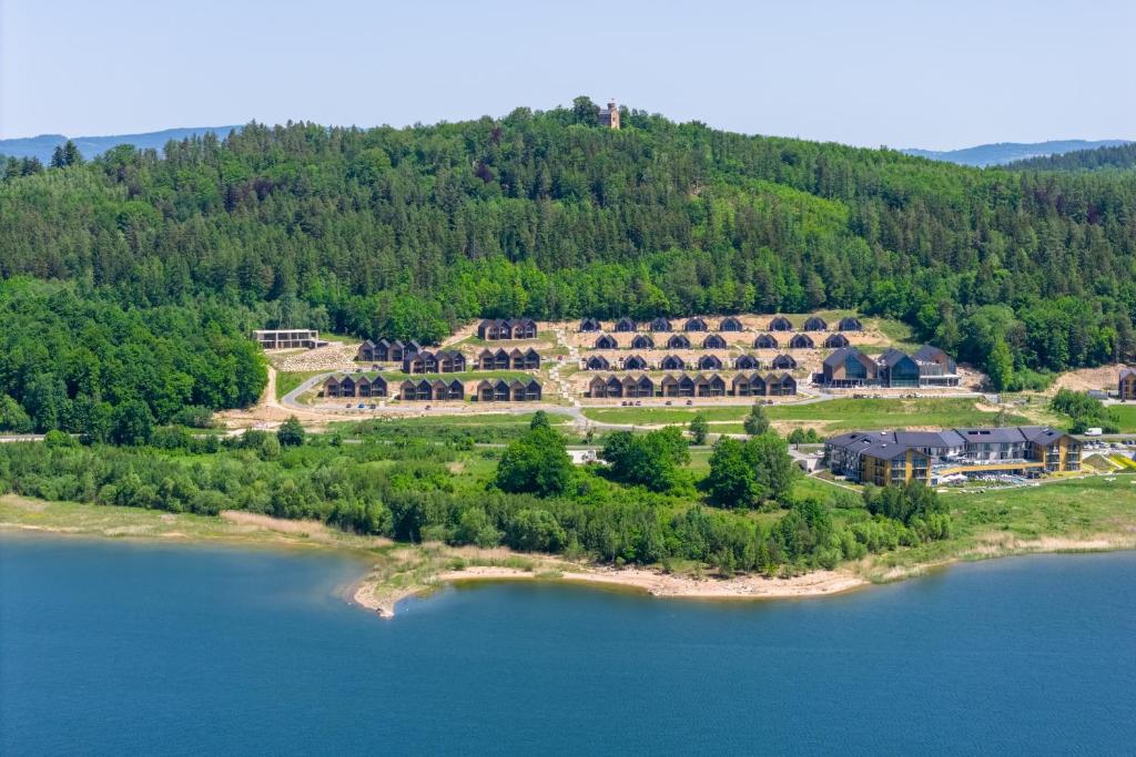 an aerial view of a resort on a lake at Lake Chwil 5618 widok na zalew i góry in Sosnówka