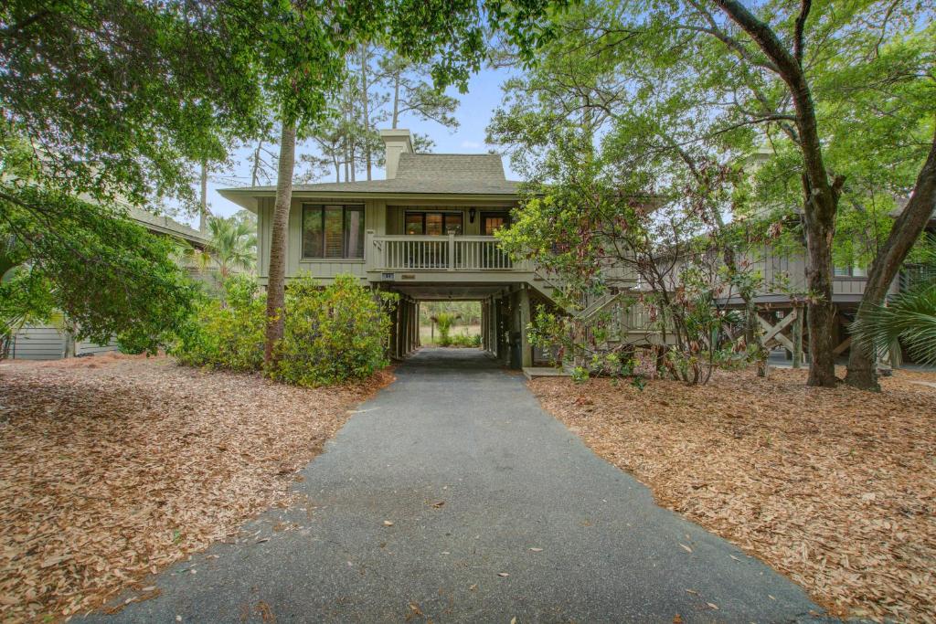 a house with a walkway in front of it at Inlet Cove 94 in Kiawah Island