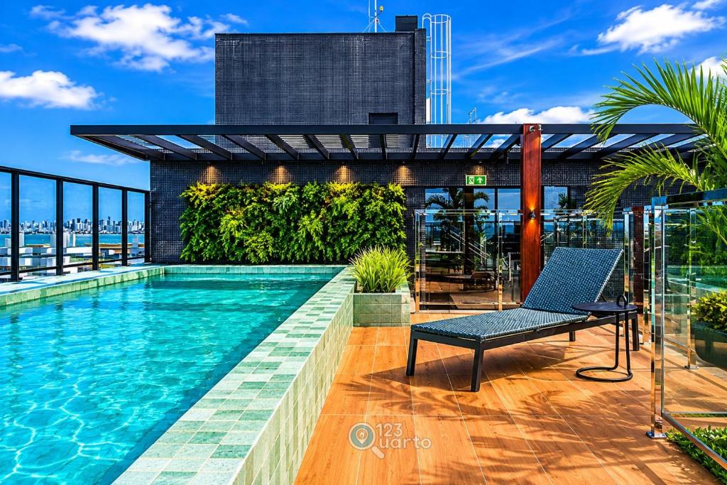 a swimming pool on the roof of a building at Emunah by 123Quarto in Camalaú