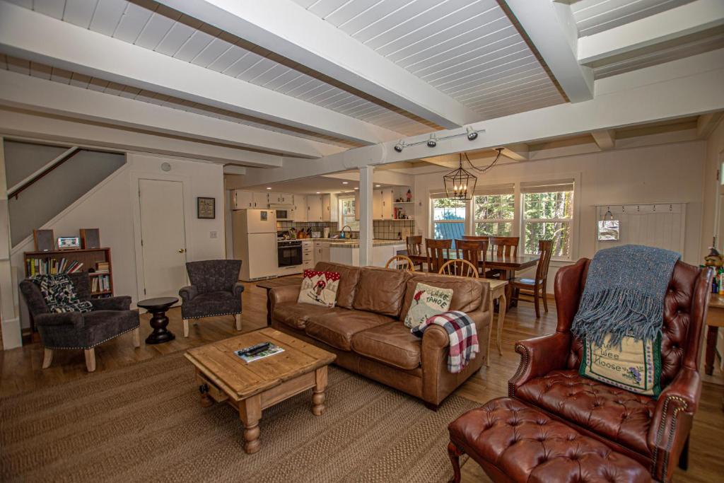a living room with a couch and chairs and a table at Hillhouse By Hauserman Rentals in Homewood