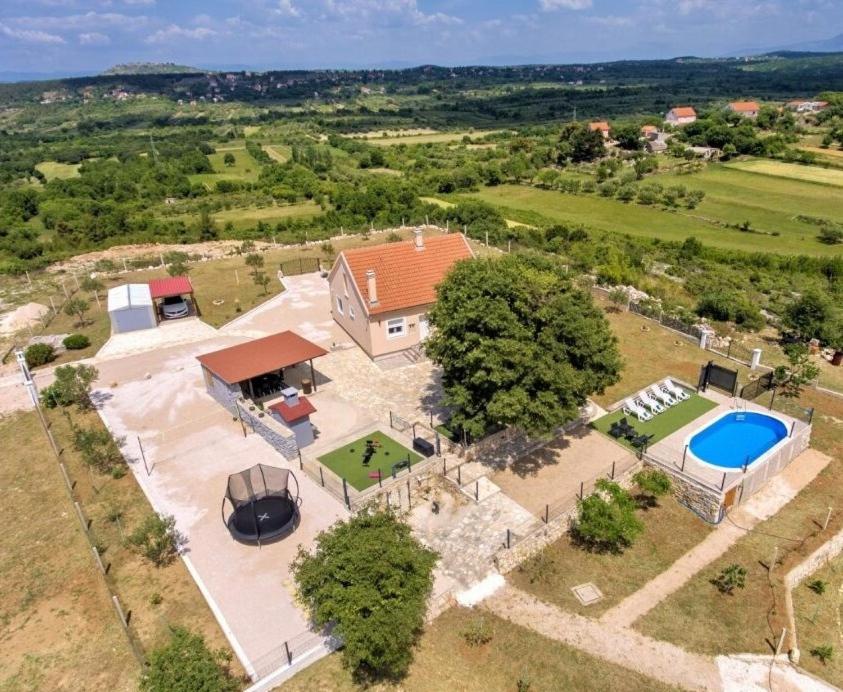 an aerial view of a house with a swimming pool at Potkova in Lađevci