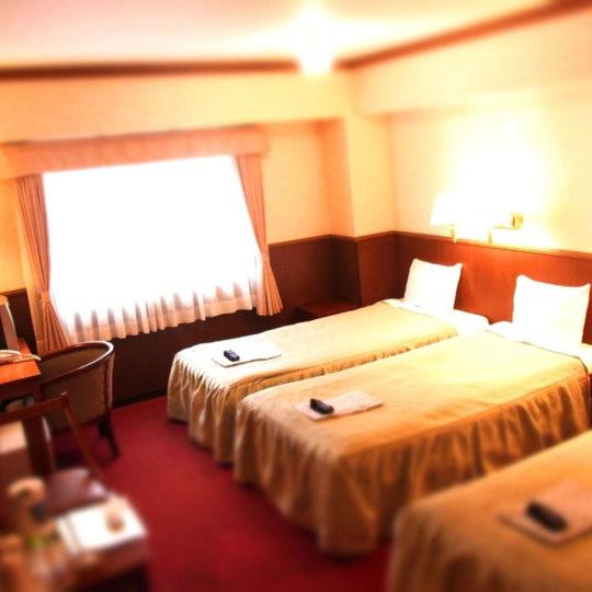 Postel nebo postele na pokoji v ubytování Gora Hotel Paipuno Kemuri Plus