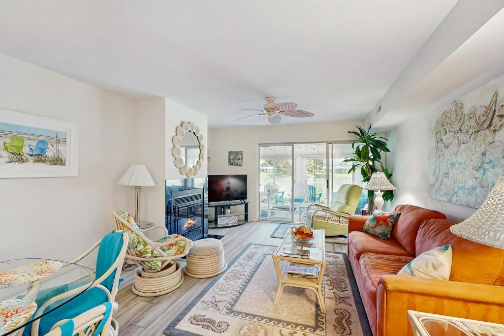 a living room with a couch and a tv at Mallard Lakes - 38082 Mockingbird Ln in Selbyville