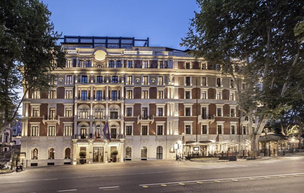 a large white building on a city street at InterContinental Rome Ambasciatori Palace by IHG in Rome