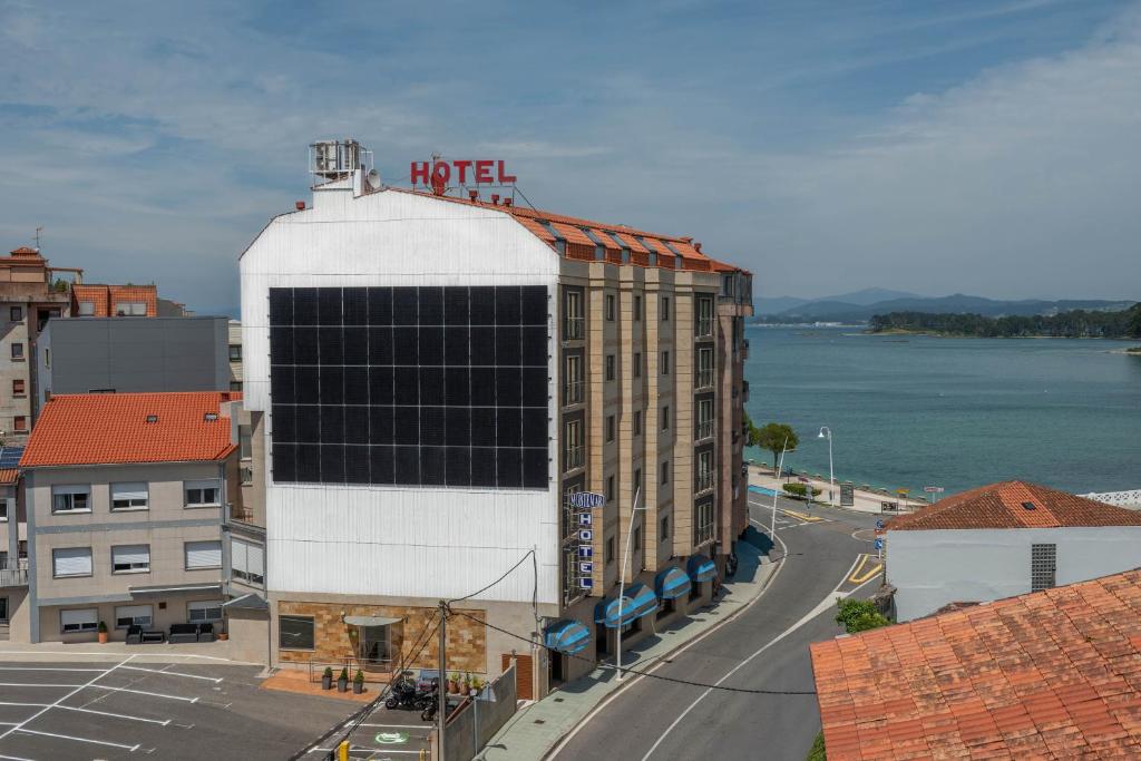 a building with a hotel sign on the top of it at Hotel Montemar *** Superior in O Grove