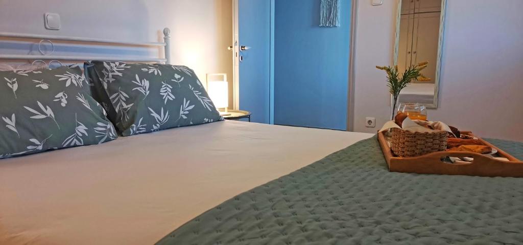 a bedroom with a bed with a basket on it at Lemon Tree Apartment with Garden in Chios