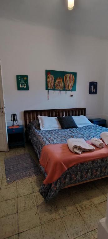 a bedroom with a bed with towels on it at LosCardones in Cafayate