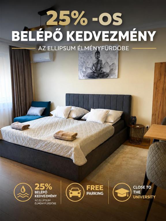 a poster for a bedroom with a bed in a room at Harmónia Home in Miskolc
