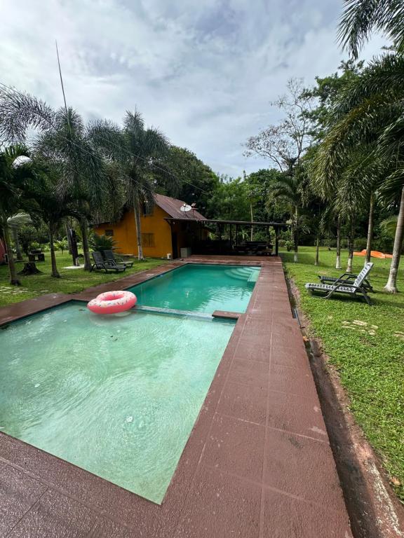 a swimming pool with a frisbee in the water at La macana Ecotour in Cacique