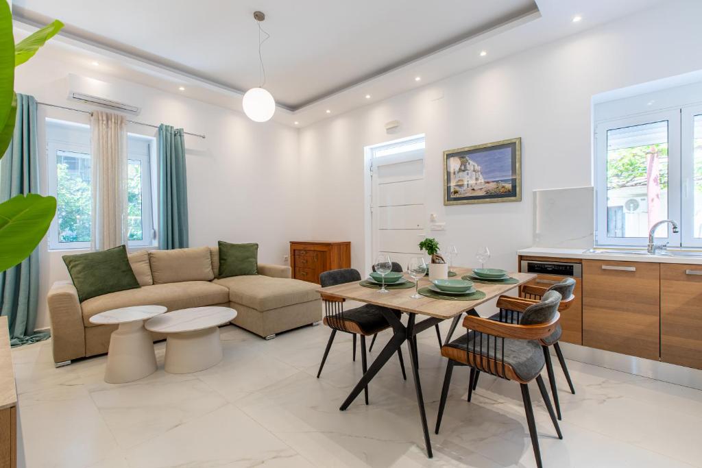a living room with a couch and a table at Casa Lili in Platanias
