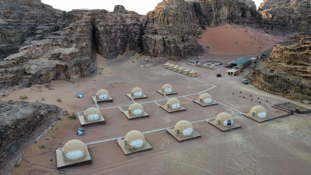 an aerial view of a desert with domes in a mountain at SaLem rum in Wadi Rum