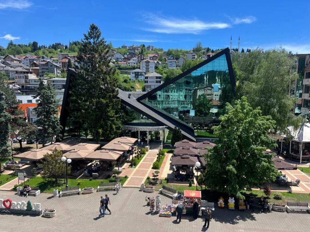 a view of a city with a large glass sculpture at Hotel Rozaje in Rožaje