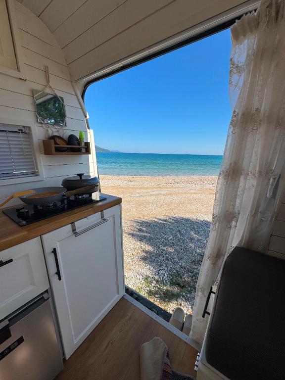 an rv with a view of the beach at Sprinter Camper Albania Rental in Tirana