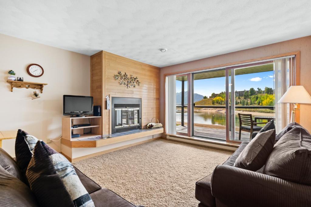 a living room with a couch and a fireplace at East Bay Condos #111 in Dillon