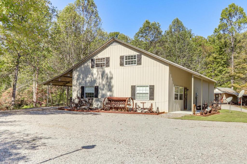 a large white house with a driveway at House & Tiny Cabin! Multi-Acre East TN Property in Englewood