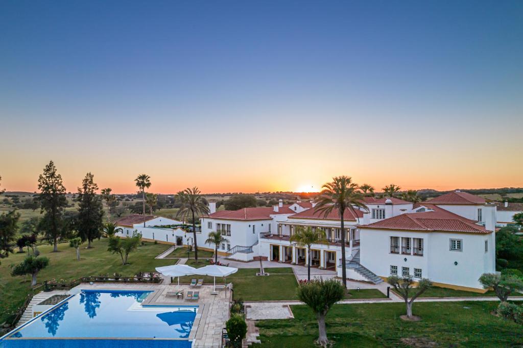 an aerial view of a house with a swimming pool at Herdade das Bernardas B&B in Vila Verde de Ficalho
