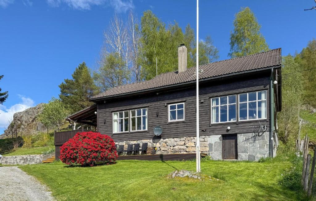 a wooden house with a stone facade at 5 Bedroom Amazing Home In Matre in Bauge