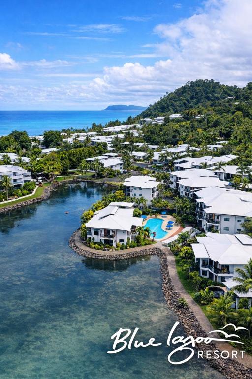 an aerial view of blue lagoon resort and the ocean at Blue Lagoon Resort in Trinity Beach