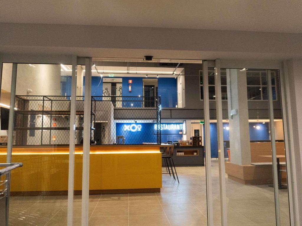 a lobby of a building with a no smoking sign at ibis Arcoverde in Arcoverde