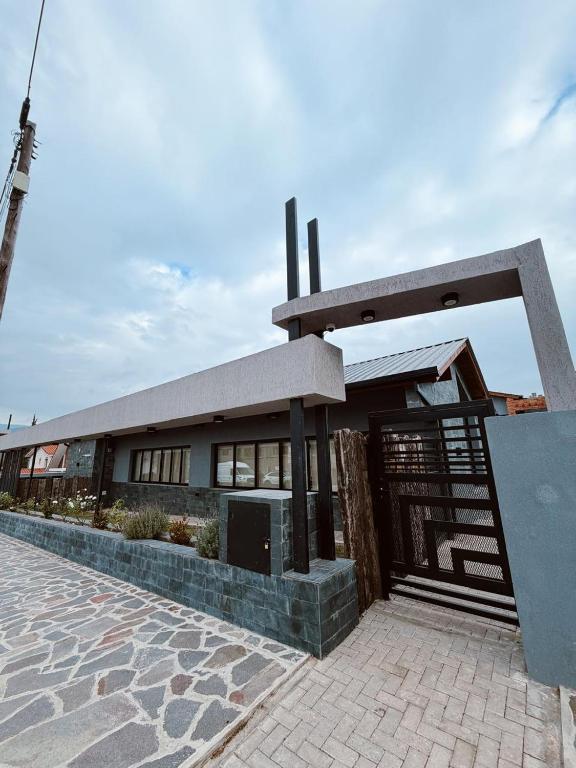 a building with a gate in front of it at Complejo in Villa General Belgrano