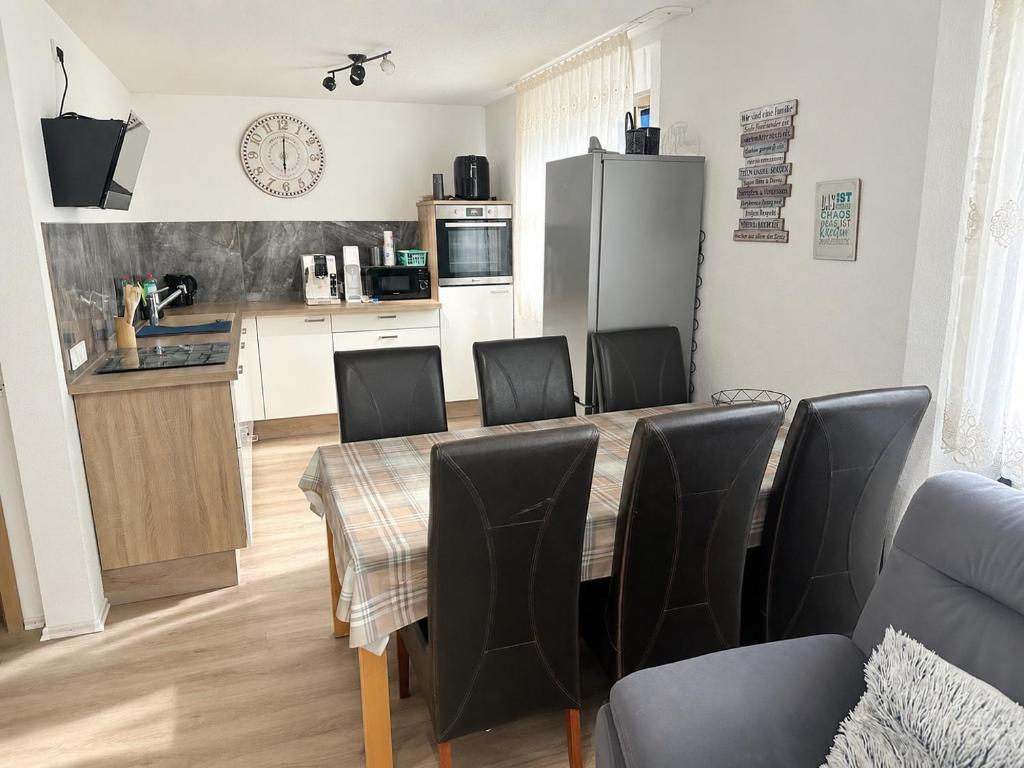 a kitchen and dining room with a table and chairs at FERIENHAUS AyNa, direkt an der Schweizer Grenze in Bad Säckingen