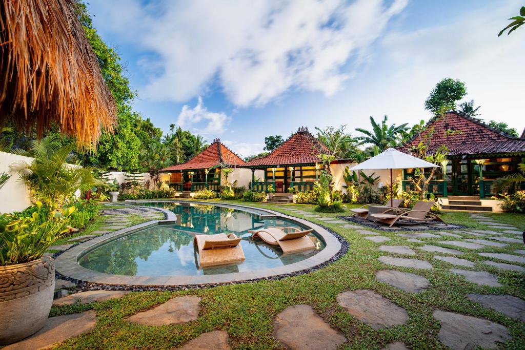 an image of a villa with a swimming pool at Juwel Villa Ubud in Ubud