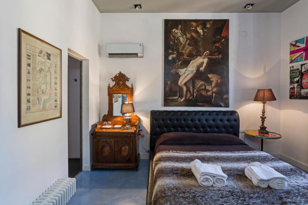 Postel nebo postele na pokoji v ubytování Loft Garibaldi