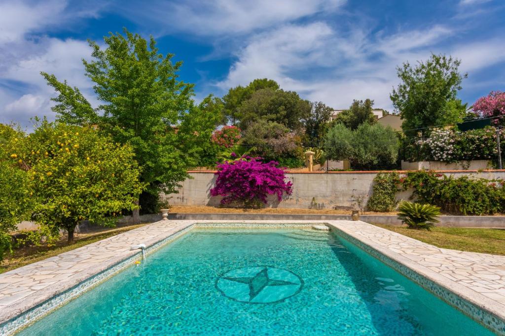 a swimming pool in a yard with trees at Modern Holiday Home Pool & Wifi in Roquebrune-sur-Argens