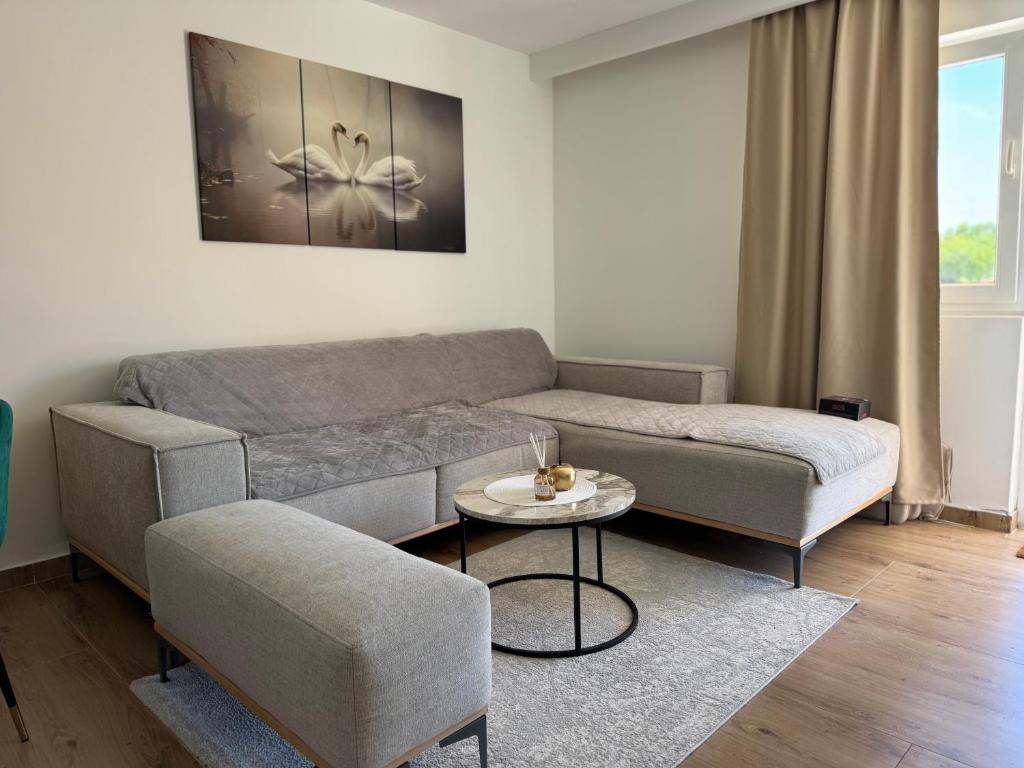 a living room with a couch and a table at Magic Home Cetinje in Cetinje