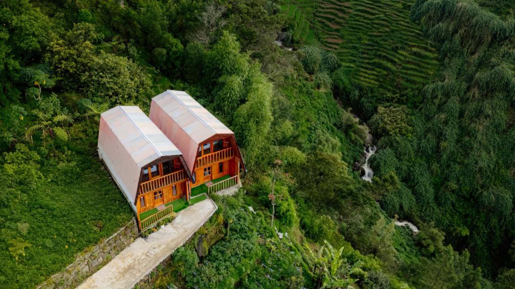 an aerial view of a train on a mountain at Emerald Cabin House in Kejajar