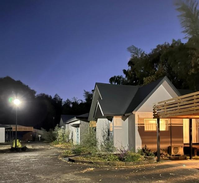 a house with a street light in front of it at グランコテージベンガルの森 in Nasu