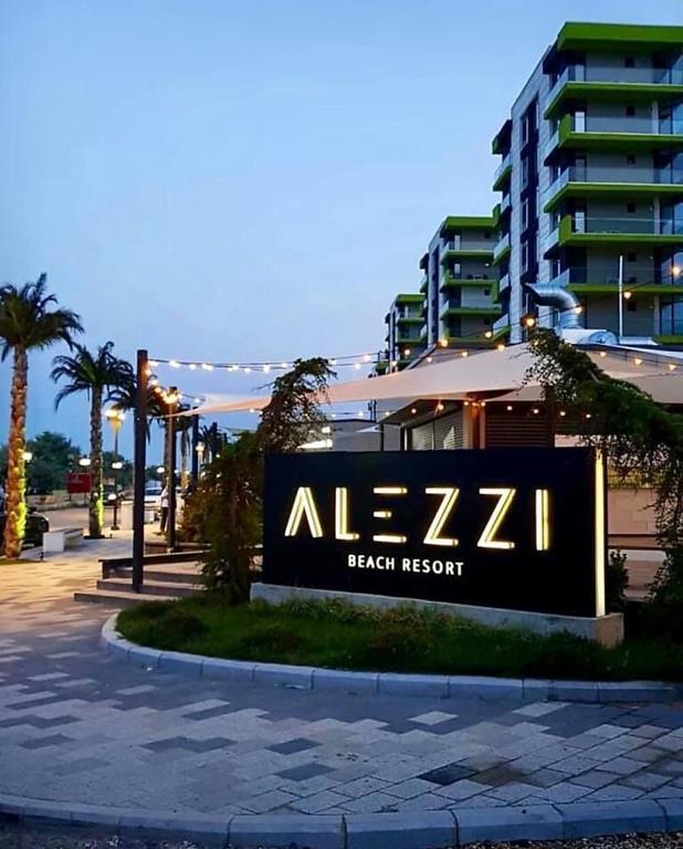 a sign for a beach resort in front of a building at Azure in Mamaia Sat/Năvodari